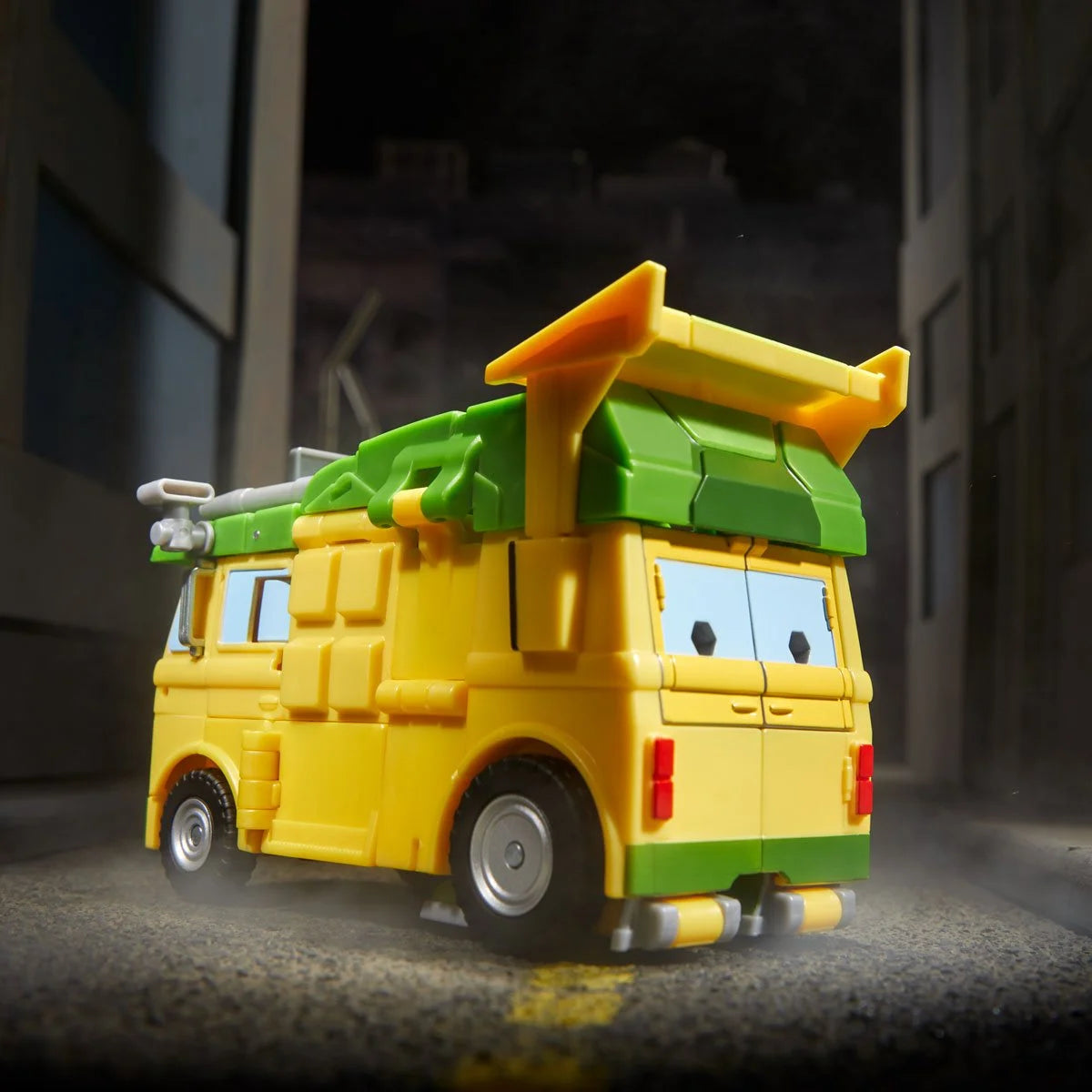 Rear view of Party Wagon alt mode showing back doors, roof panel, and exhaust detailing.