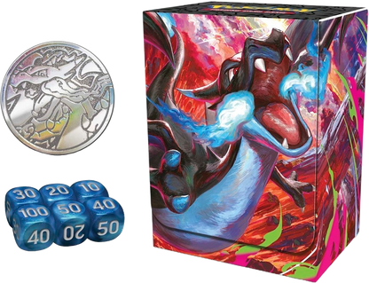 Mega Charizard X ex Ultra-Premium Collection accessories including the metal Charizard coin, blue damage-counter dice, and Charizard deck box with flame artwork.